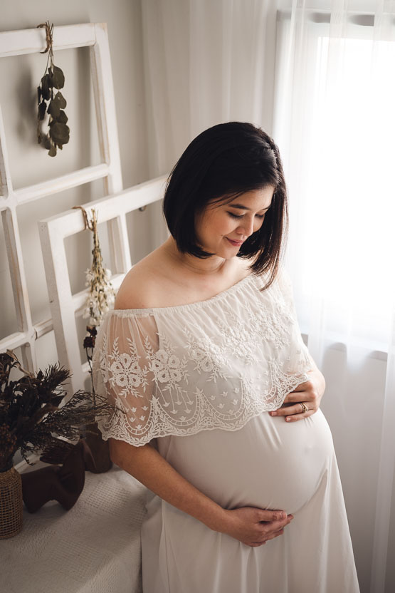 Maternity pregnancy photoshoot in white dress