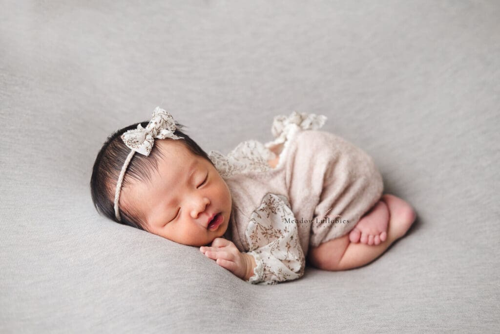 Newborn Photography Singapore newborn photography bum up pose on plain grey backdrop