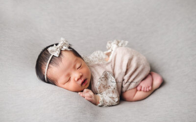 newborn photography bum up pose on plain grey backdrop