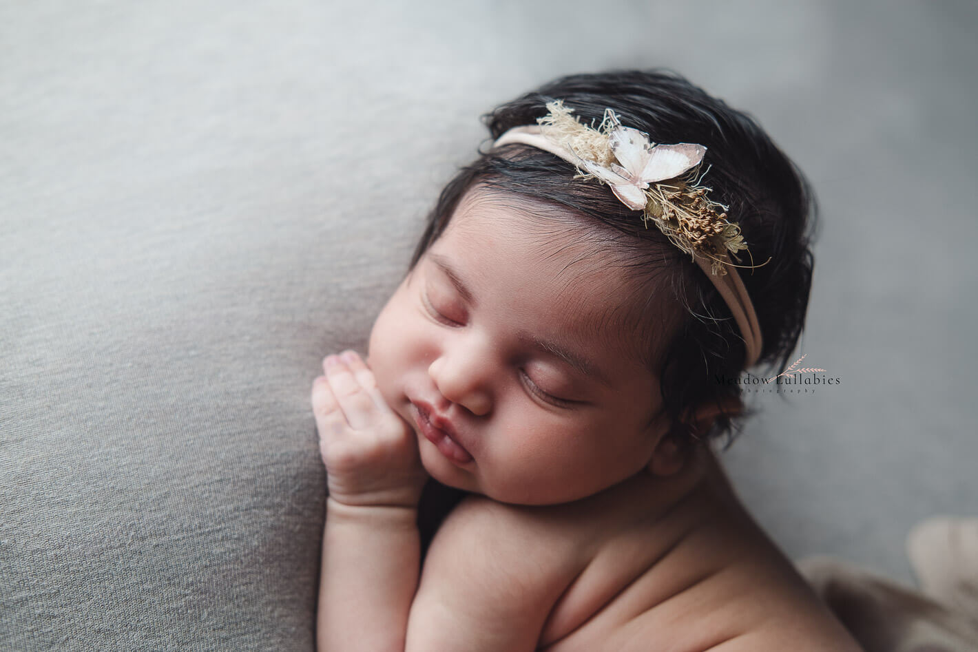 Angled close-up shot of beautiful sleeping baby with delicate features
