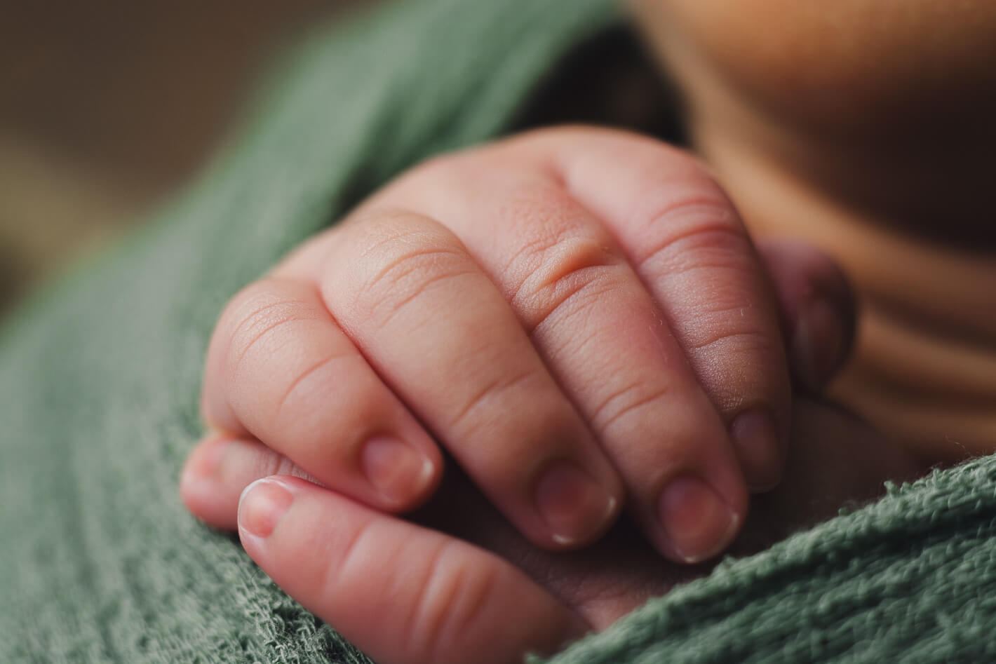 Close-up shot of a newborn's finger