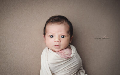 Newborn photography Singapore Stern baby face staring at photographer